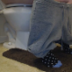 This video focuses on the lower legs of a woman who is farting, pissing, and taking a shit while sitting on a toilet. Subtle plops are heard. About 2.5 minutes.